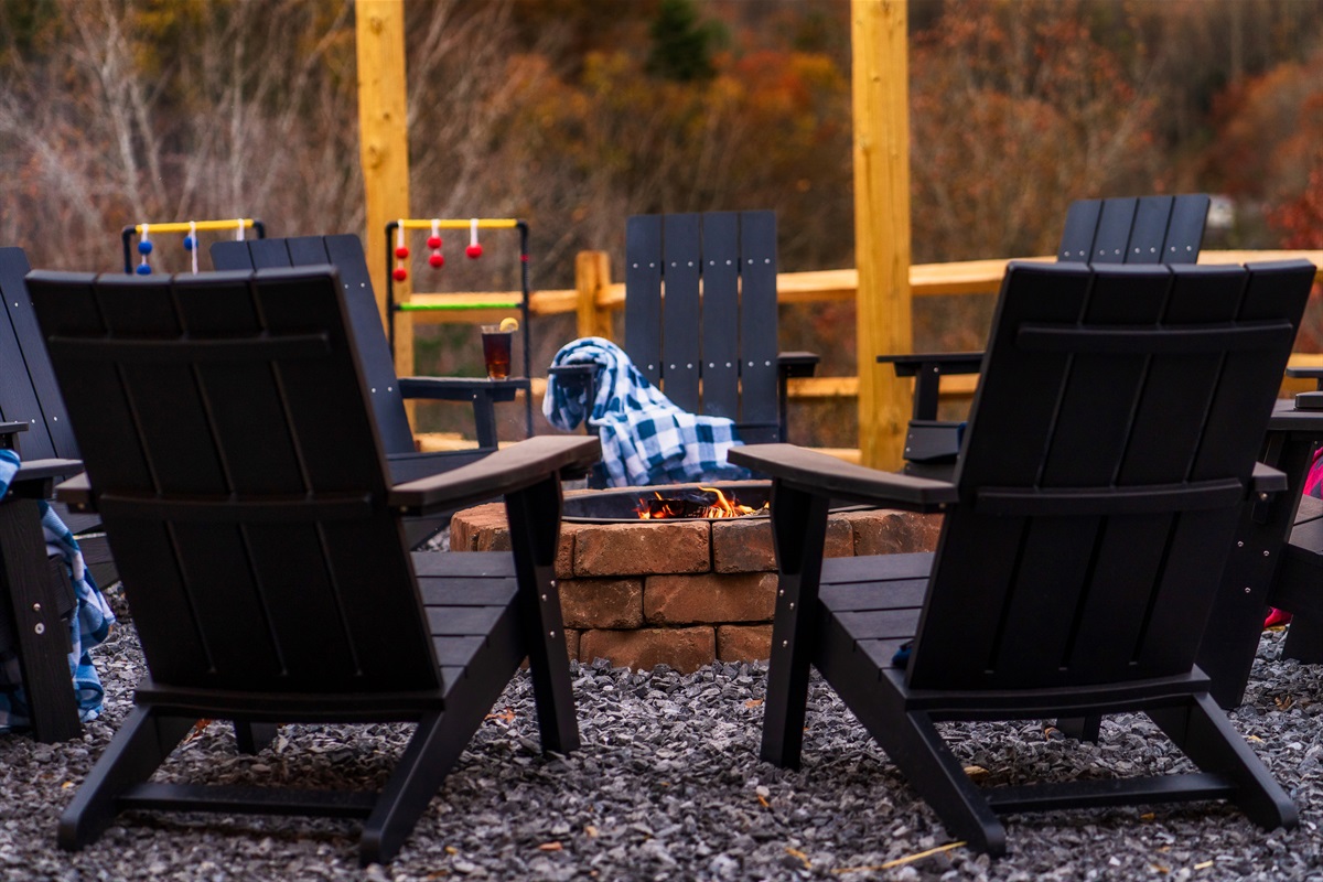 Fire Pit in backyard with picnic tables & views