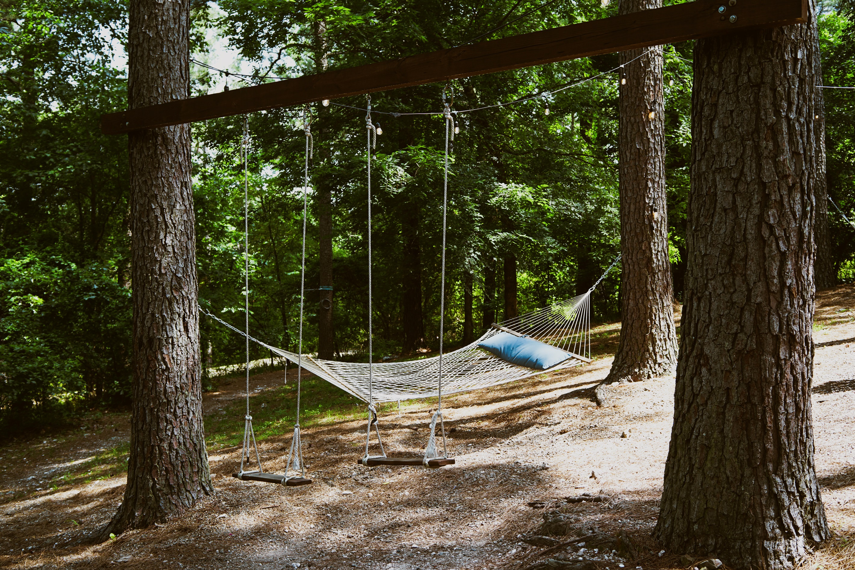 Sway in the breeze under tall pines in the outdoor hammocks built for total relaxation.