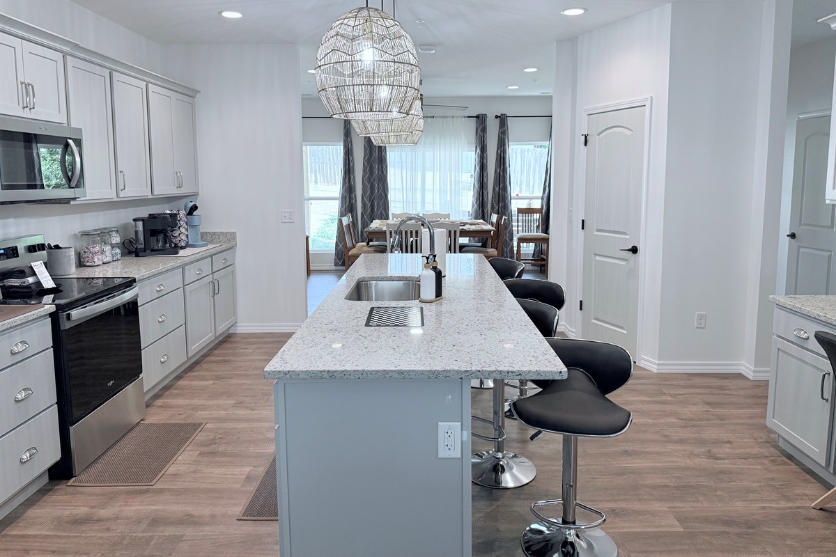 Huge gourmet kitchen is open to living room and dining room. Perfect for large gatherings.