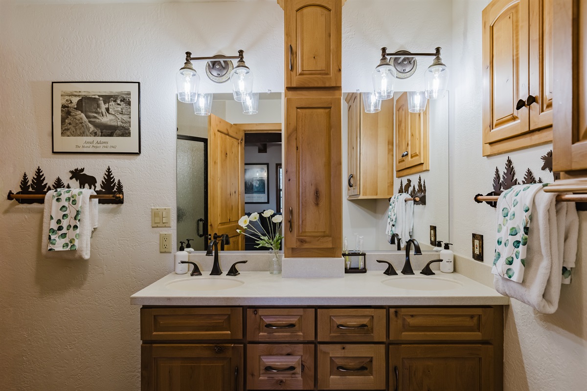 The ensuite master bath has modern fixtures, a spacious vanity, and warm natural textures. A perfect spot to unwind after a day exploring Pagosa’s trails or hot springs.