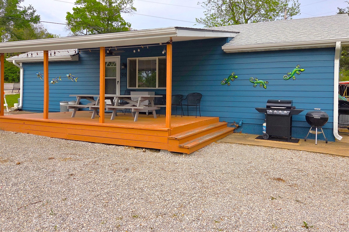The large front deck is a perfect hangout for anytime of the day with a ceiling fan, plenty of seating, and views overlooking Table Rock Lake!