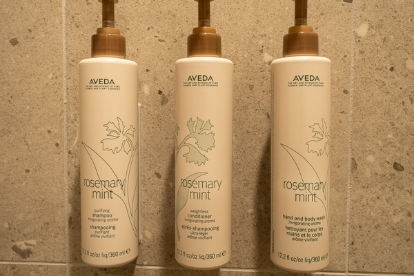Elevated bath amenities with Aveda products for a spa-like stay