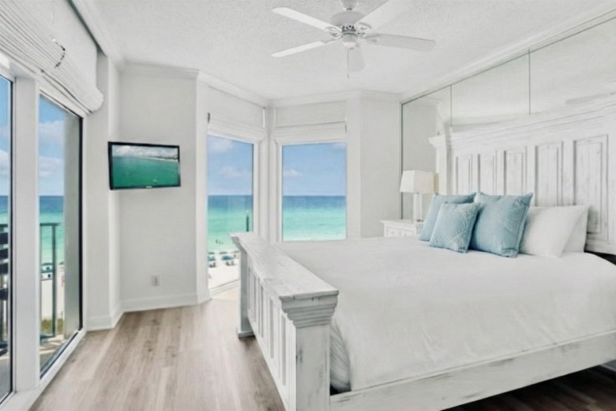 Spacious master bedroom features a King bed, Gulf views, balcony access, Smart TV w/ cable access, spacious bathroom with walk in shower + Soaker tub, and large closet - NEW PHOTOS COMING SOON!