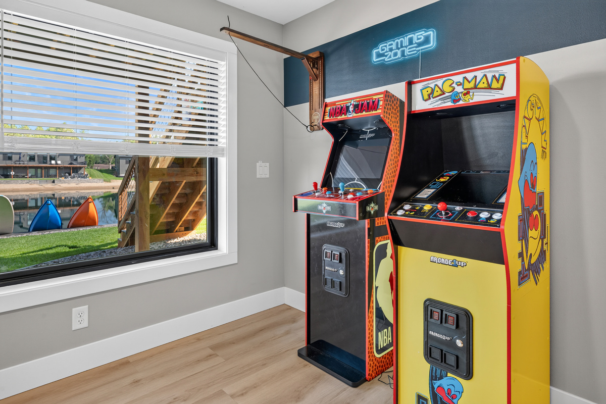 Lounge downstairs game area with foose ball, large lego wall and some arcade games