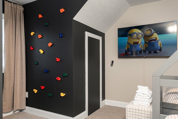 A colorful indoor rock wall for safe and exciting play.