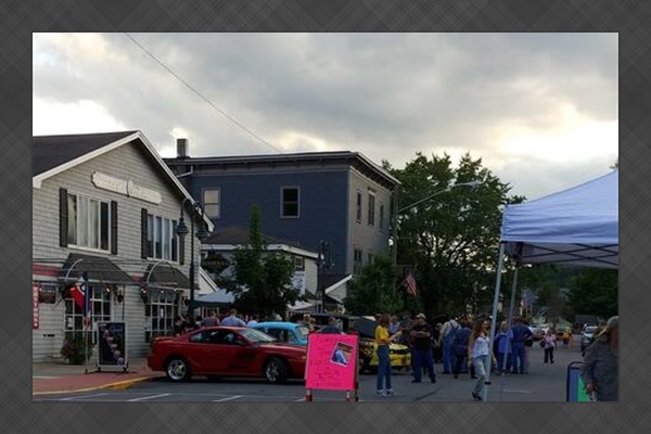 Binnekill Square Apartments and retail during a main street event. 