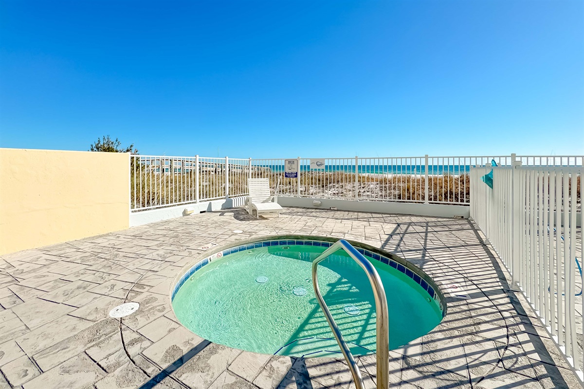 Enjoy access to premium amenities including this relaxing hot tub and sparkling pool, all within a beautifully landscaped setting.