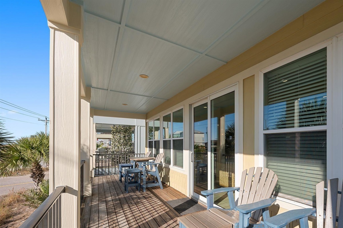 Beautiful covered front porch with Gulf views and plenty of seating 