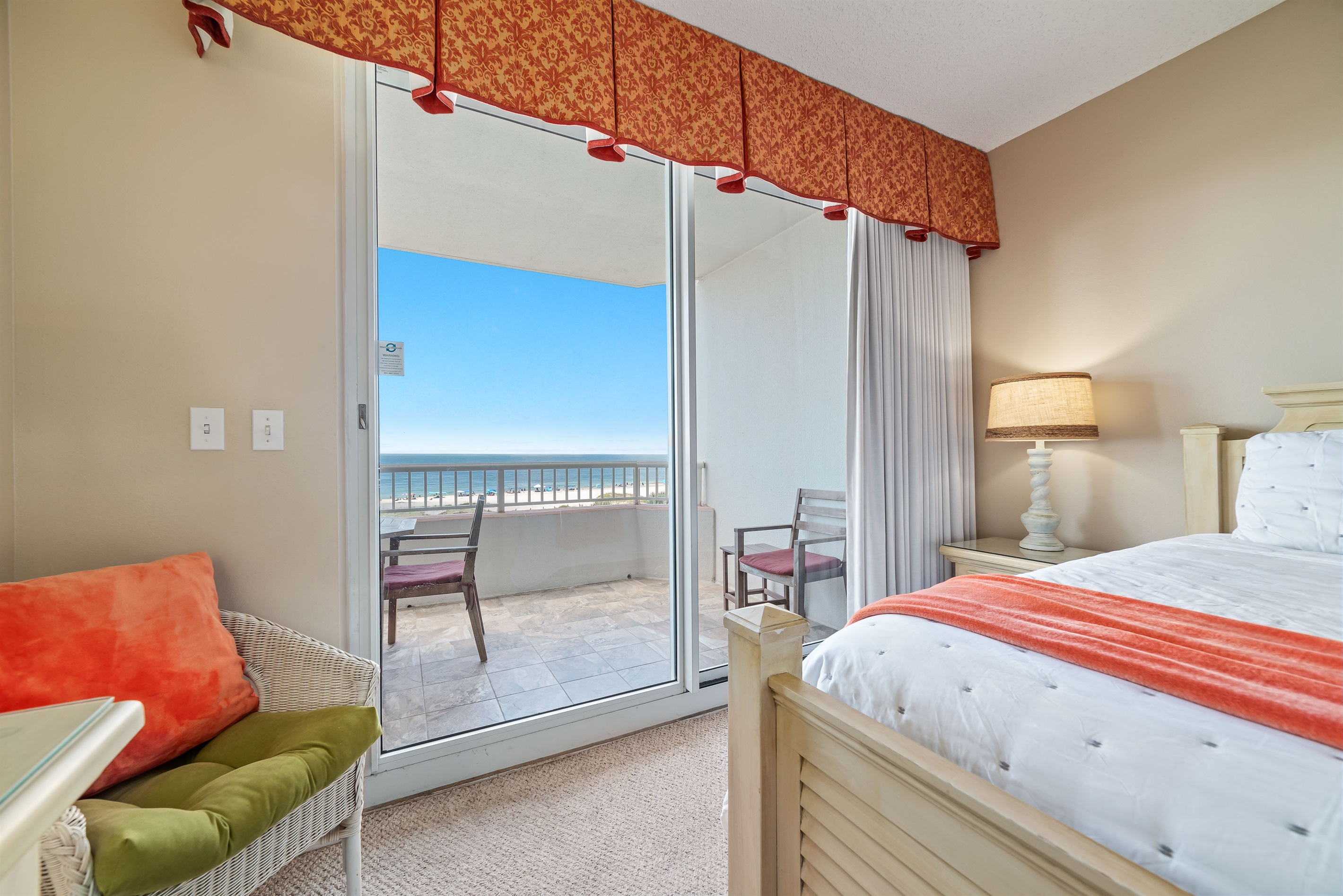 Escape to tranquility in this beautifully appointed bedroom, where the soothing sounds of the ocean are just beyond the balcony.