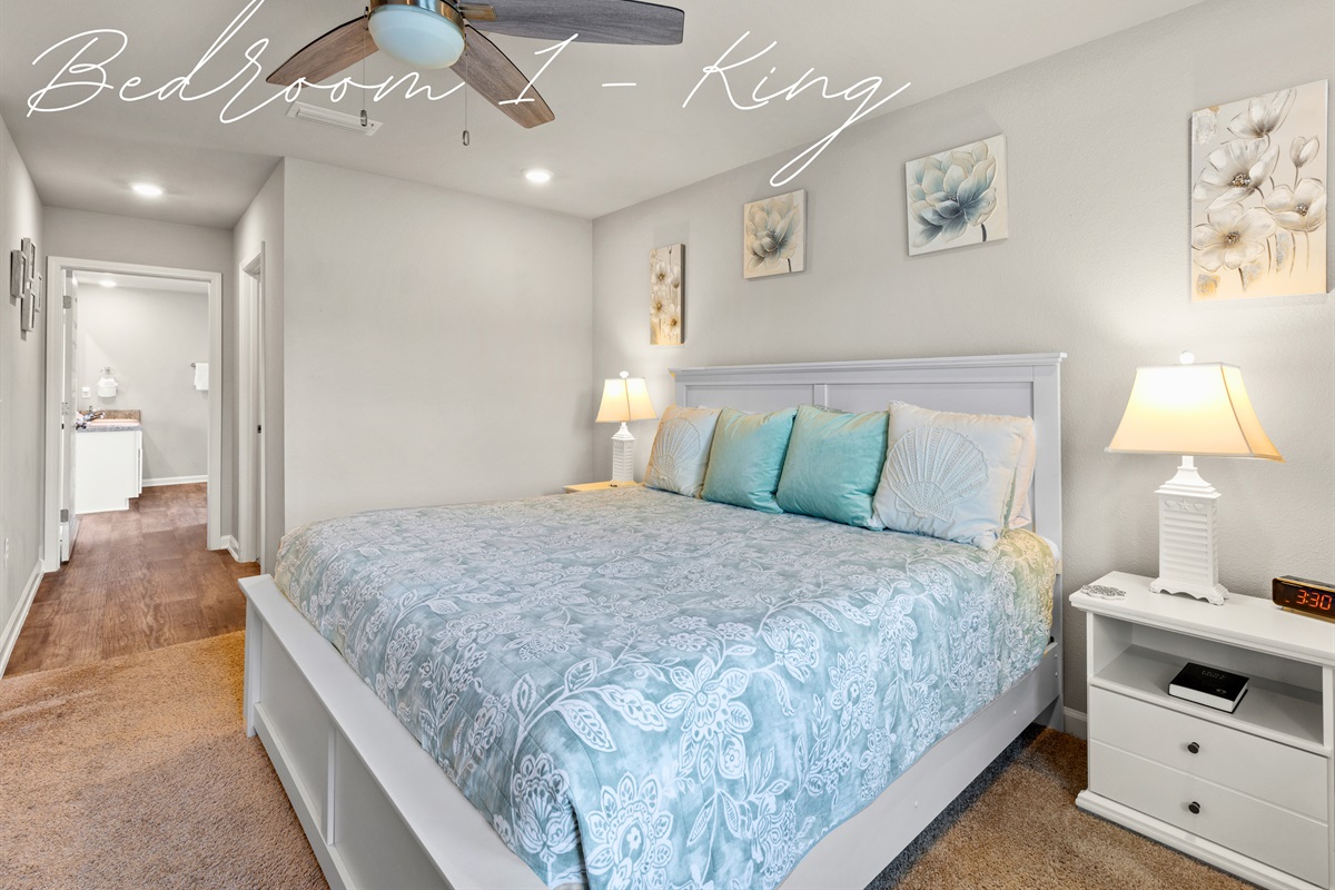 Primary bedroom with king bed, plush linens, and a peaceful atmosphere for restful nights.