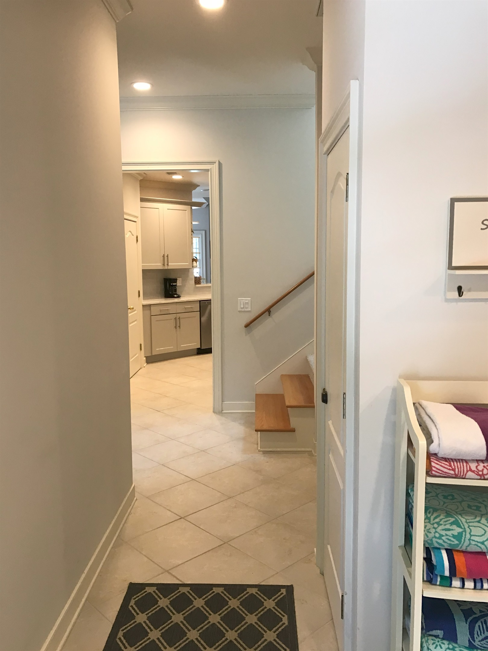 Hallway from side entrance looking into kitchen
