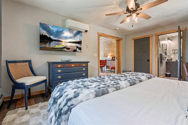 Spacious upstairs master suite with king bed, Smart TV, and private ensuite.