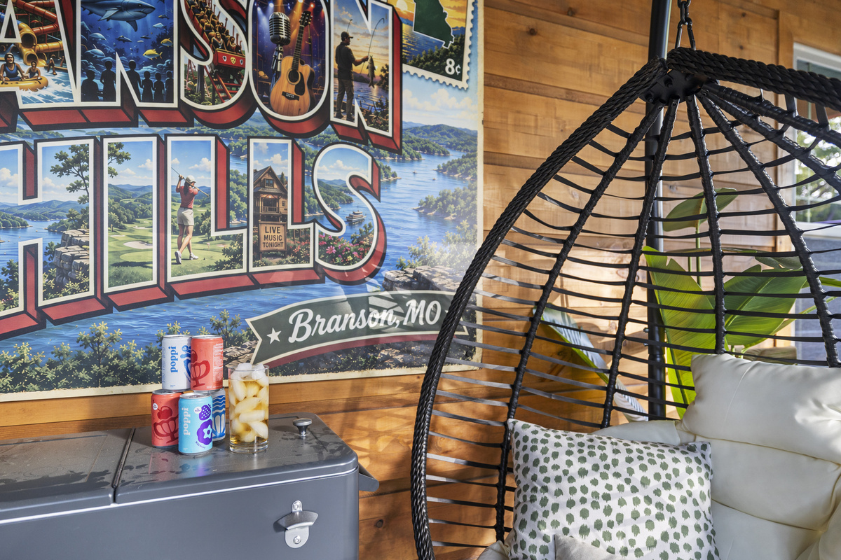 Vintage 'Branson Hills' postcard art brightens the seating nook.
