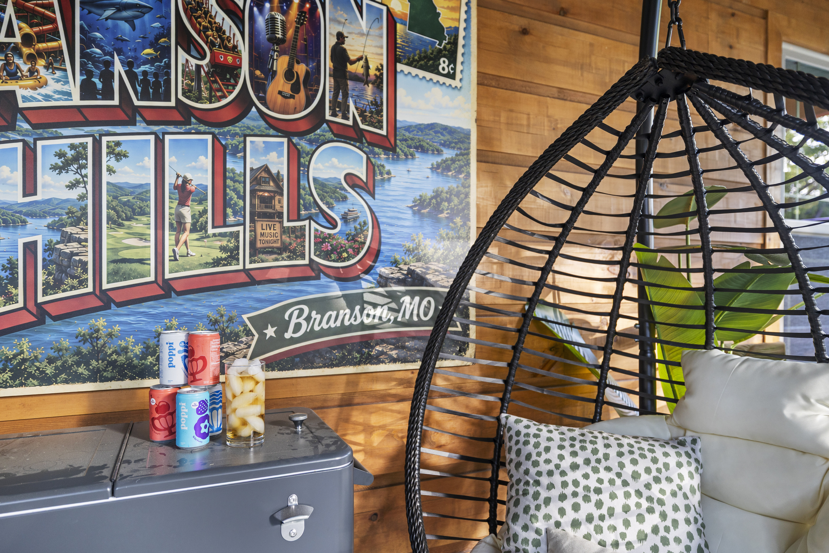 Vintage 'Branson Hills' postcard art brightens the seating nook.