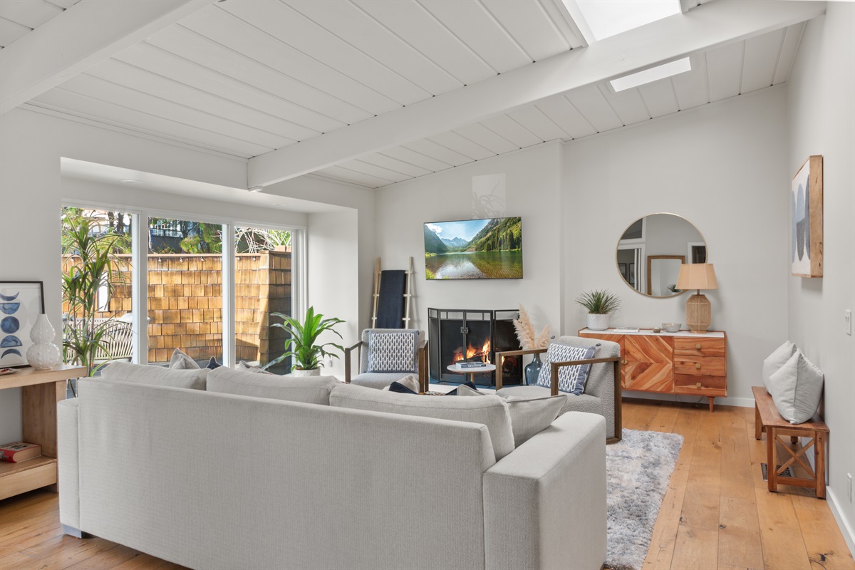 Living room with fireplace and TV