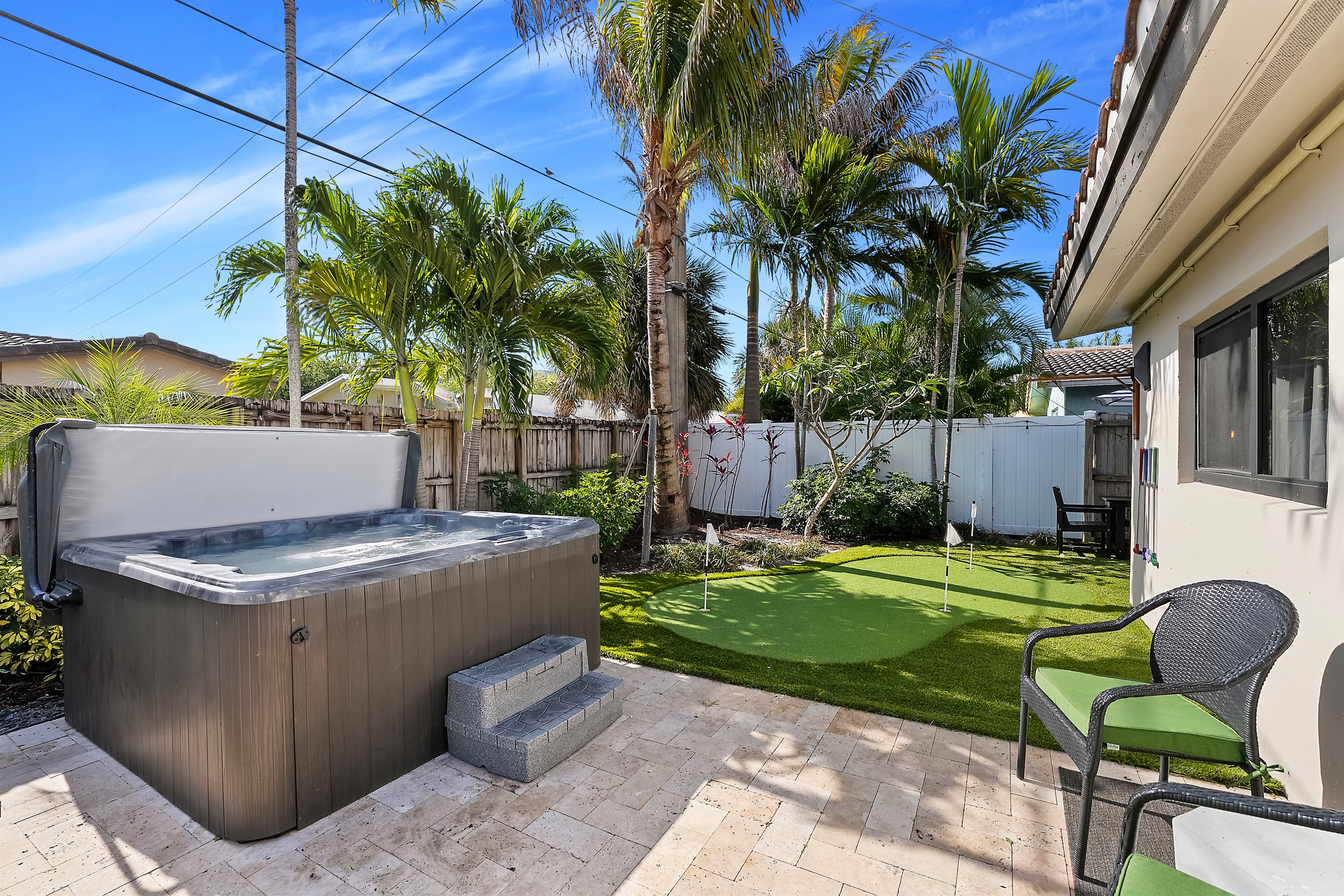 Relax and recharge in your bubbling backyard oasis w/ 92 jets and seating for 7