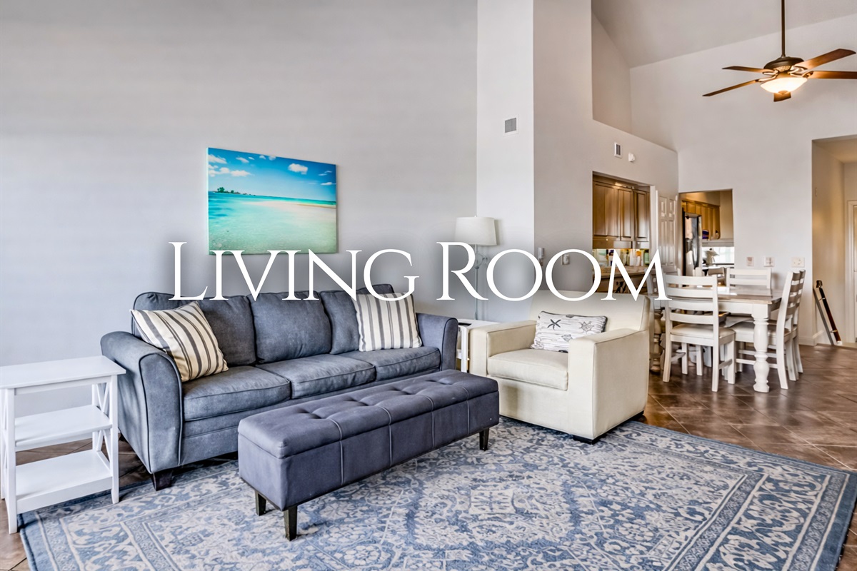Settle into a bright, comfortable living room that invites you to kick back and relax after a beach day.