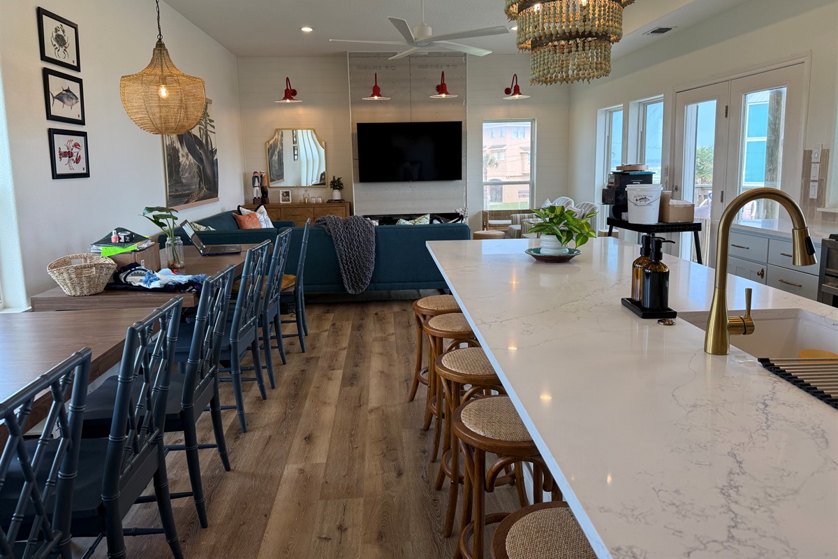 Dinner Tables seats 12-13, and the island barstools add 6 more seats. Great for family meal time. 
