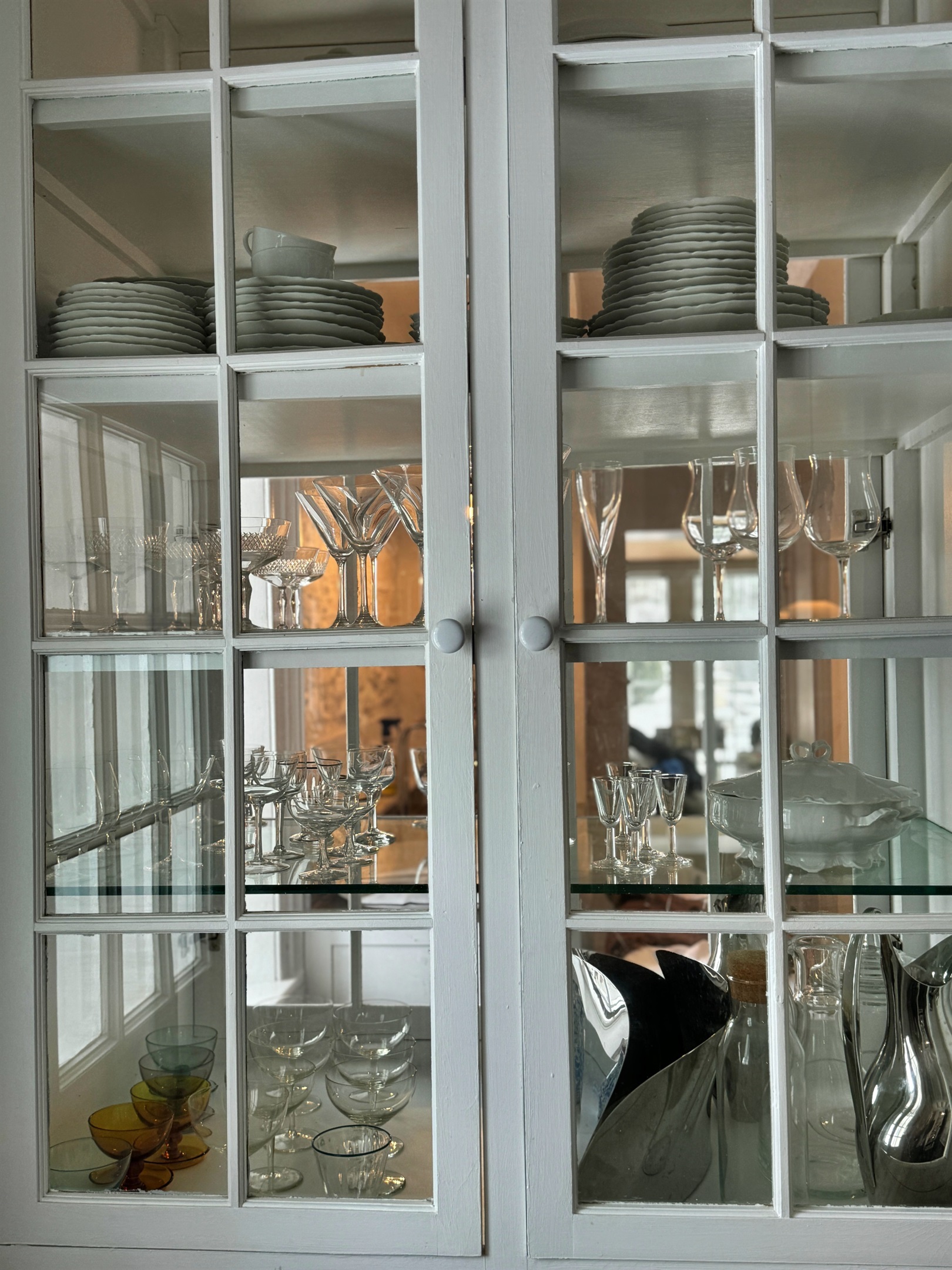 Hawk Field House - glasses and serve ware perfectly placed in the double sided china cabinet.