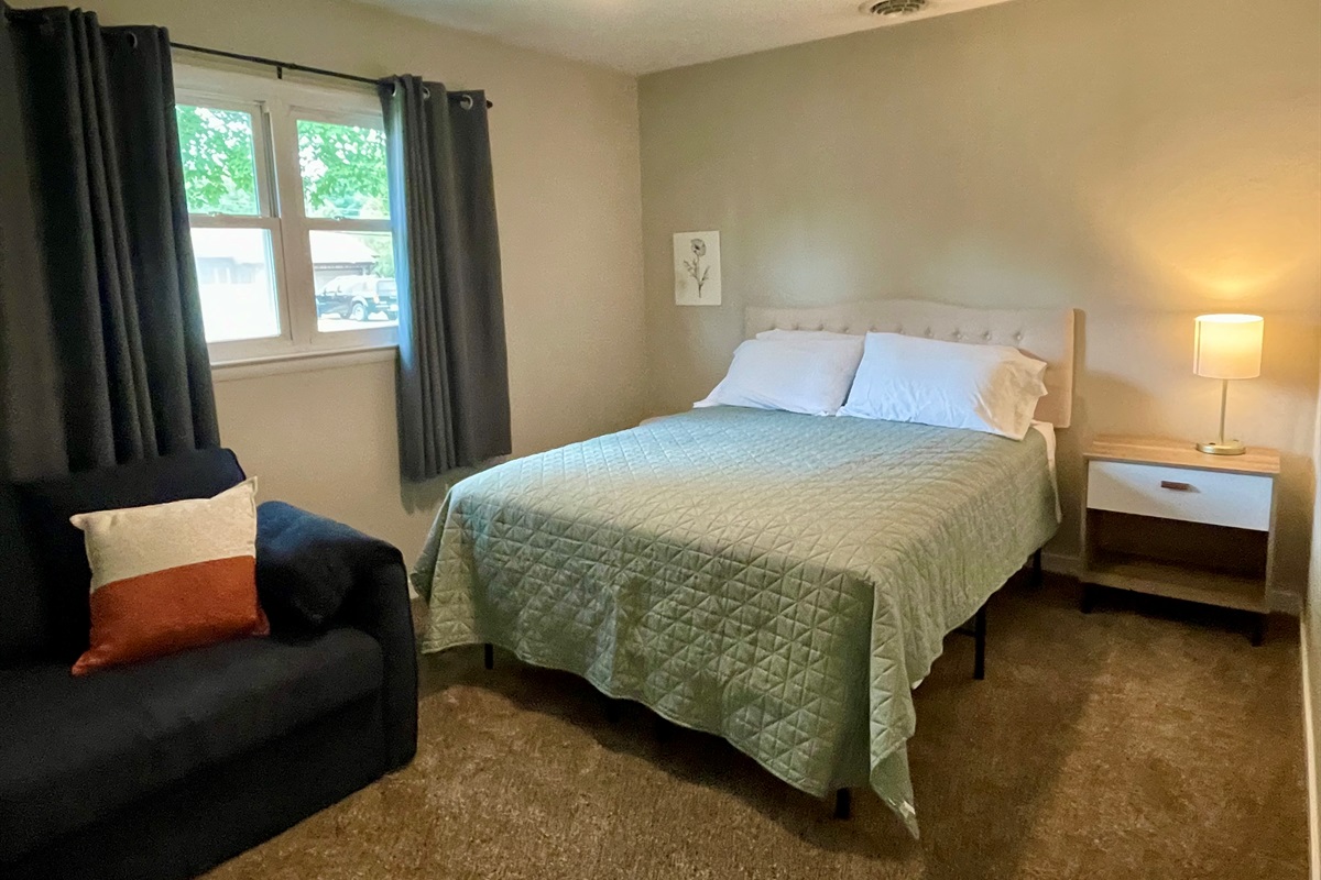 Bedroom one with queen bed and pullout twin bed
