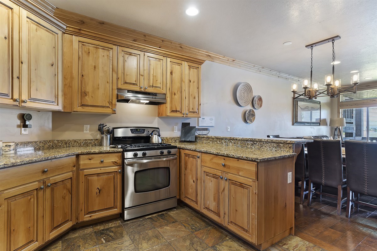 Well-appointed kitchen with granite countertops and stainless steel appliances.