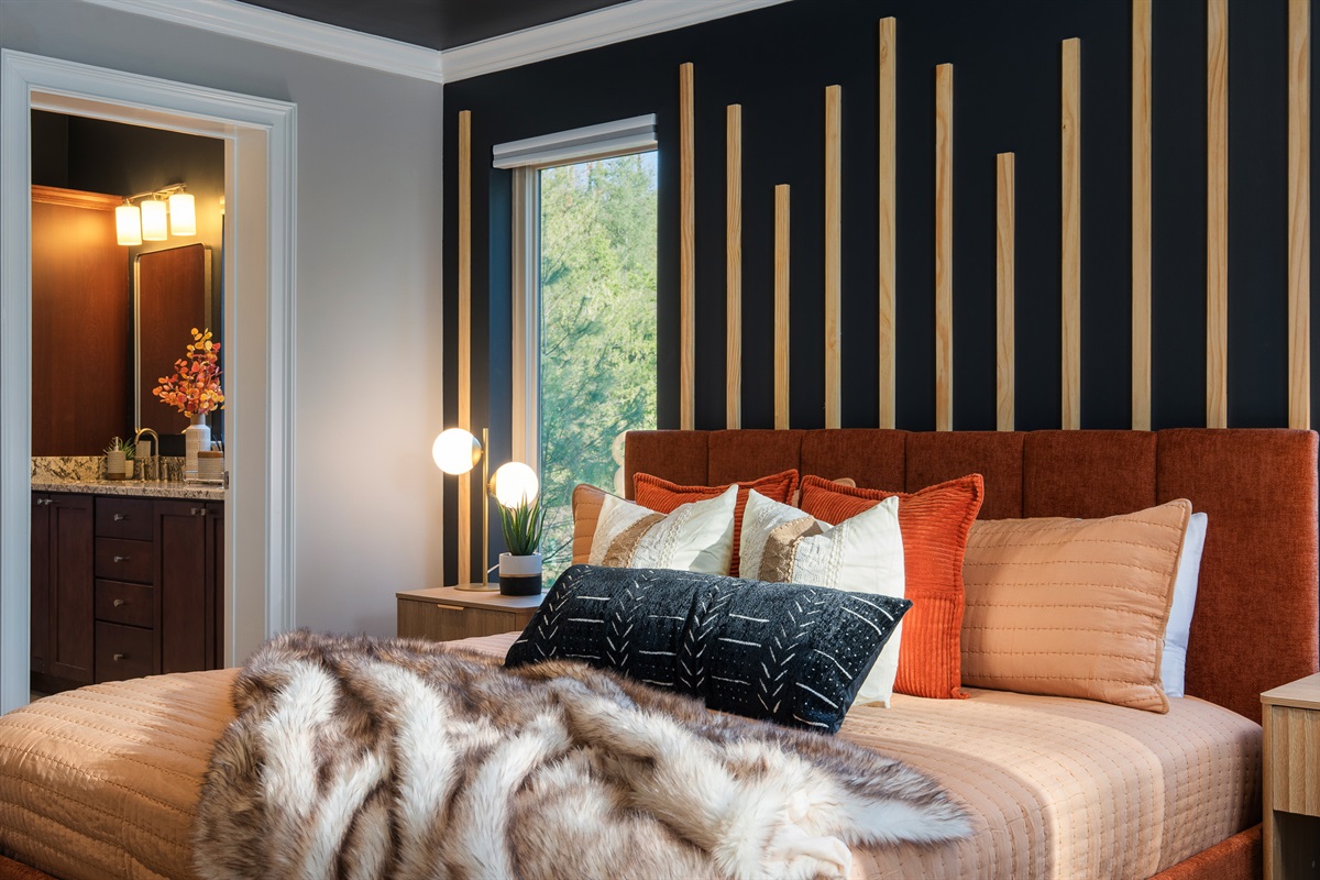 King bedroom with thoughtful styling and en suite access - ideal for couples or primary guests