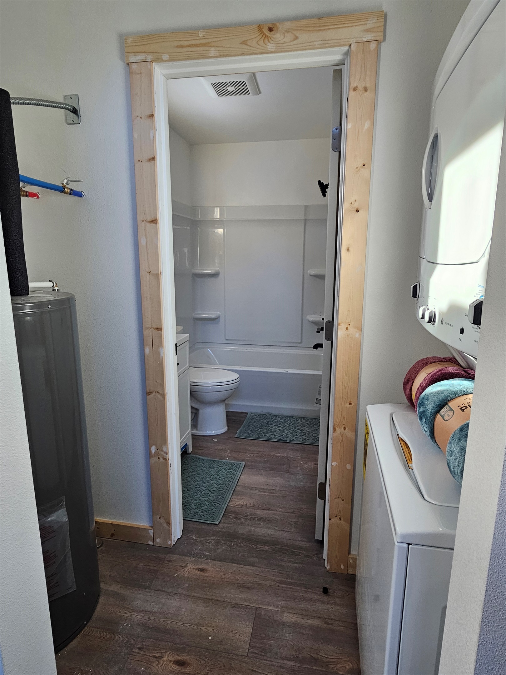 Washer/Dryer located just outside of the bathroom door.