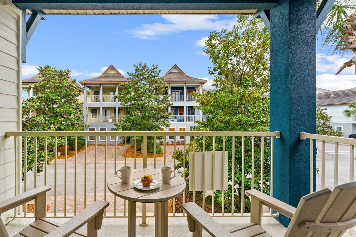 The second floor balcony is where the adults retreat. Grab a drink, catch the Gulf breeze, and let the kids play below.