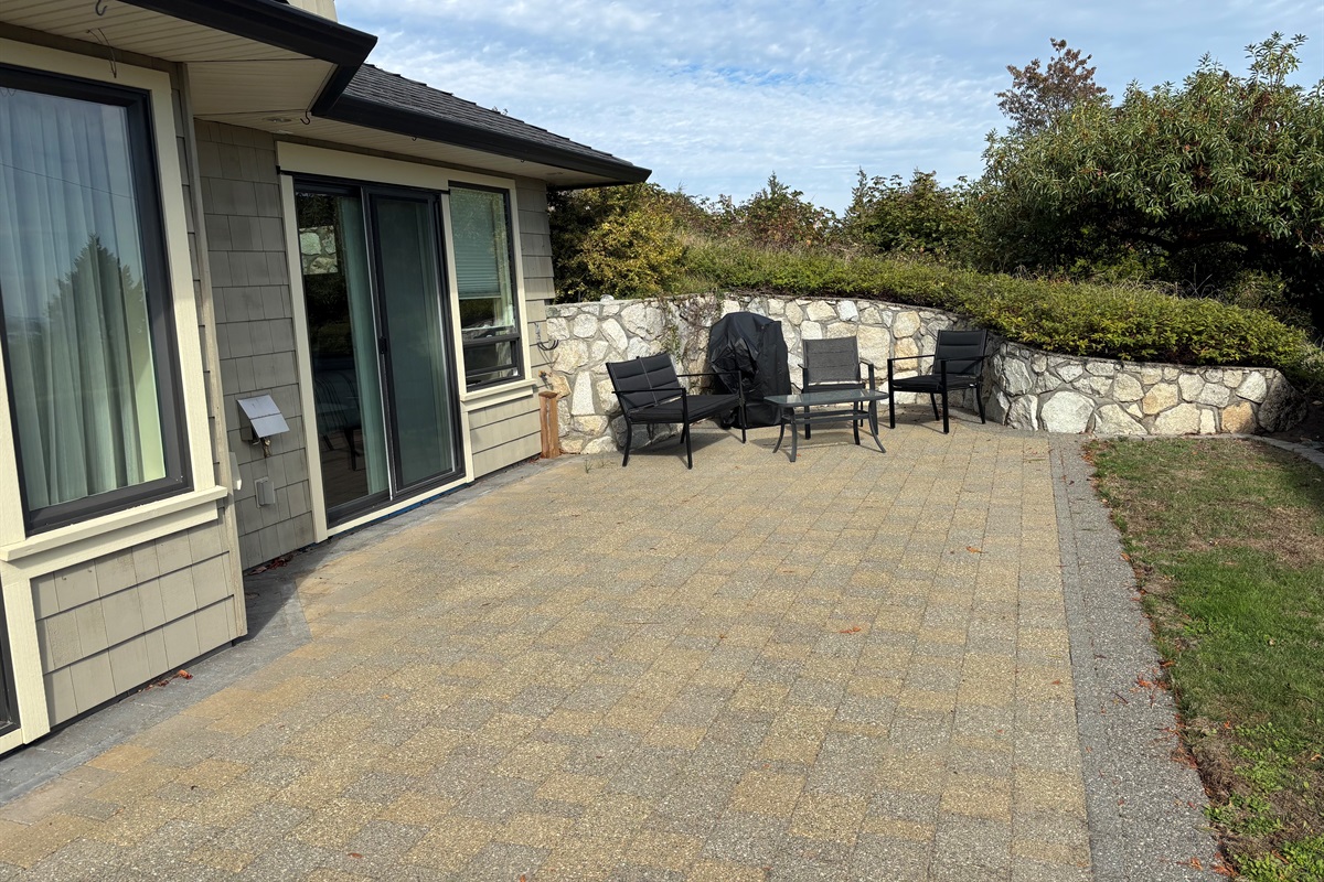 Huge patio area with seating and BBQ
