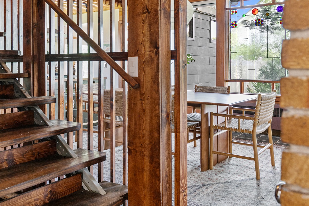 Open, slatted-wood stairs showcase the home’s sleek modern design.