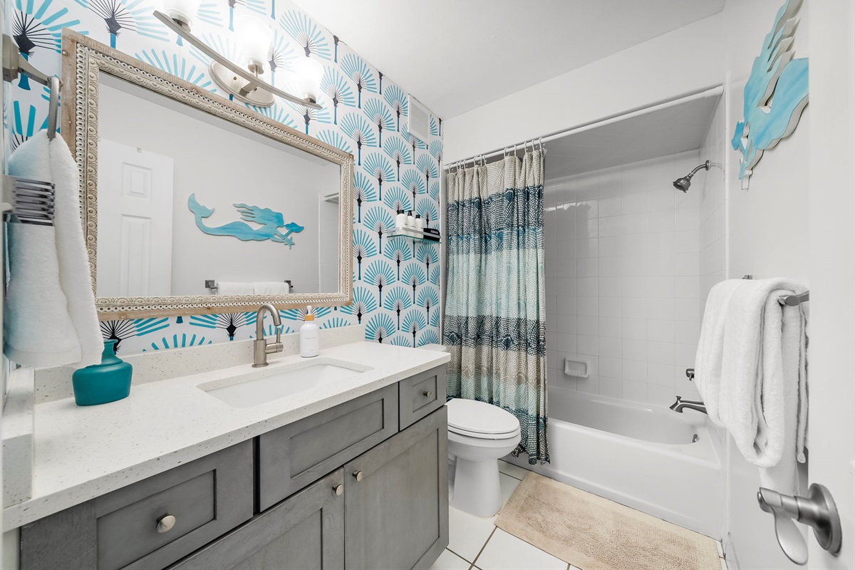 Master Bathroom offers shampoo, conditioner, body wash, makeup towels and plush white bath towels for that luxurious spa feel.