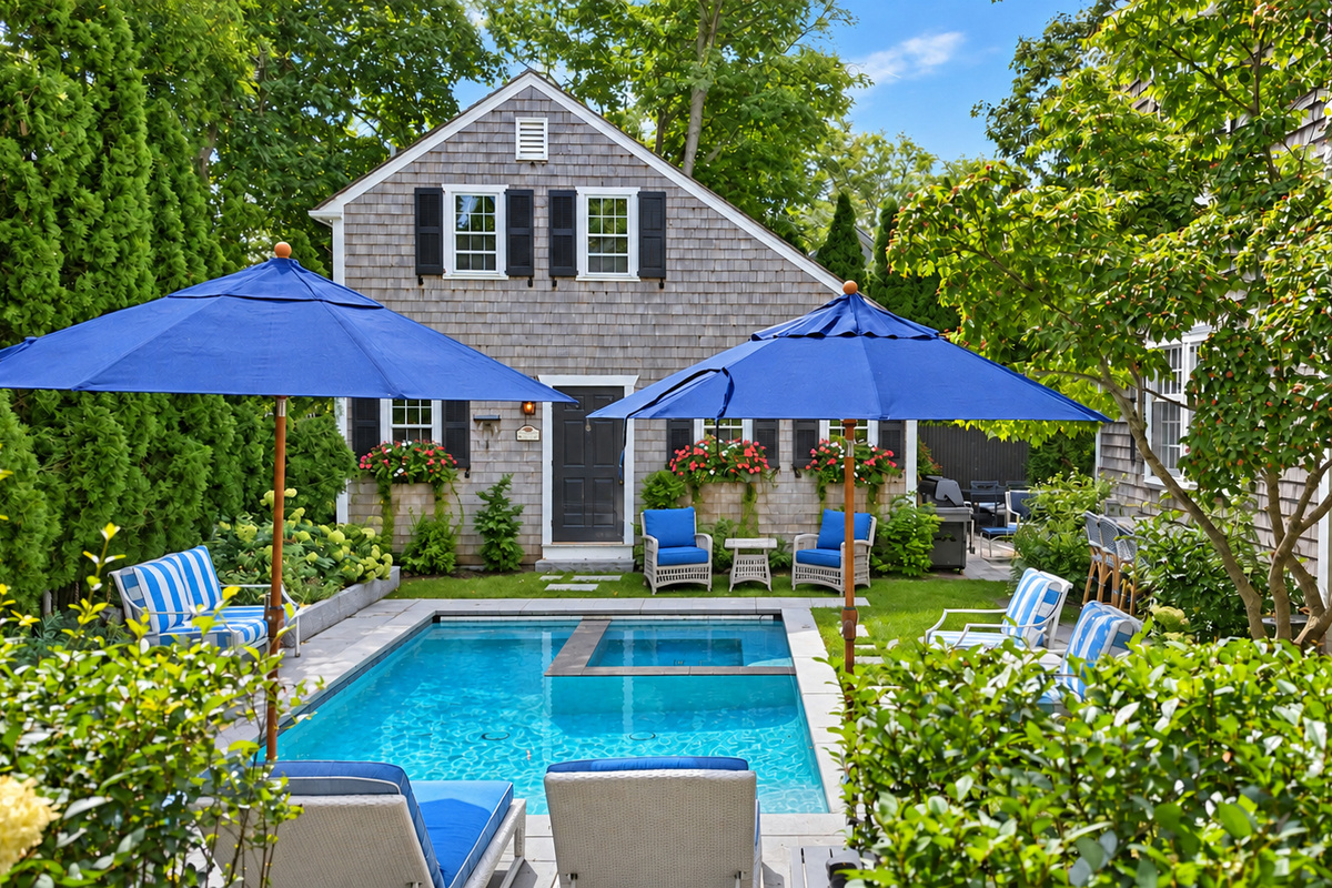 Poolside loungers beneath the umbrella