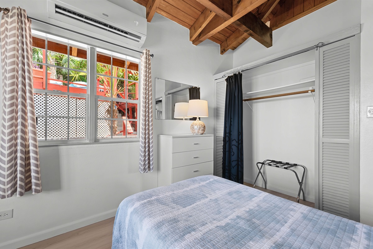 The large window overlooks the pool deck