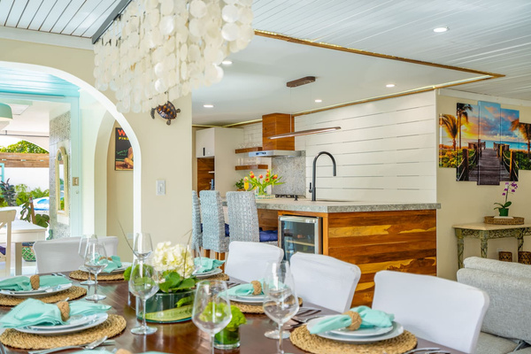 Here is a view locking back from the dinning area to the kitchen. You can glimps a bit of the wine fridge, and part of the breakfast nook. 