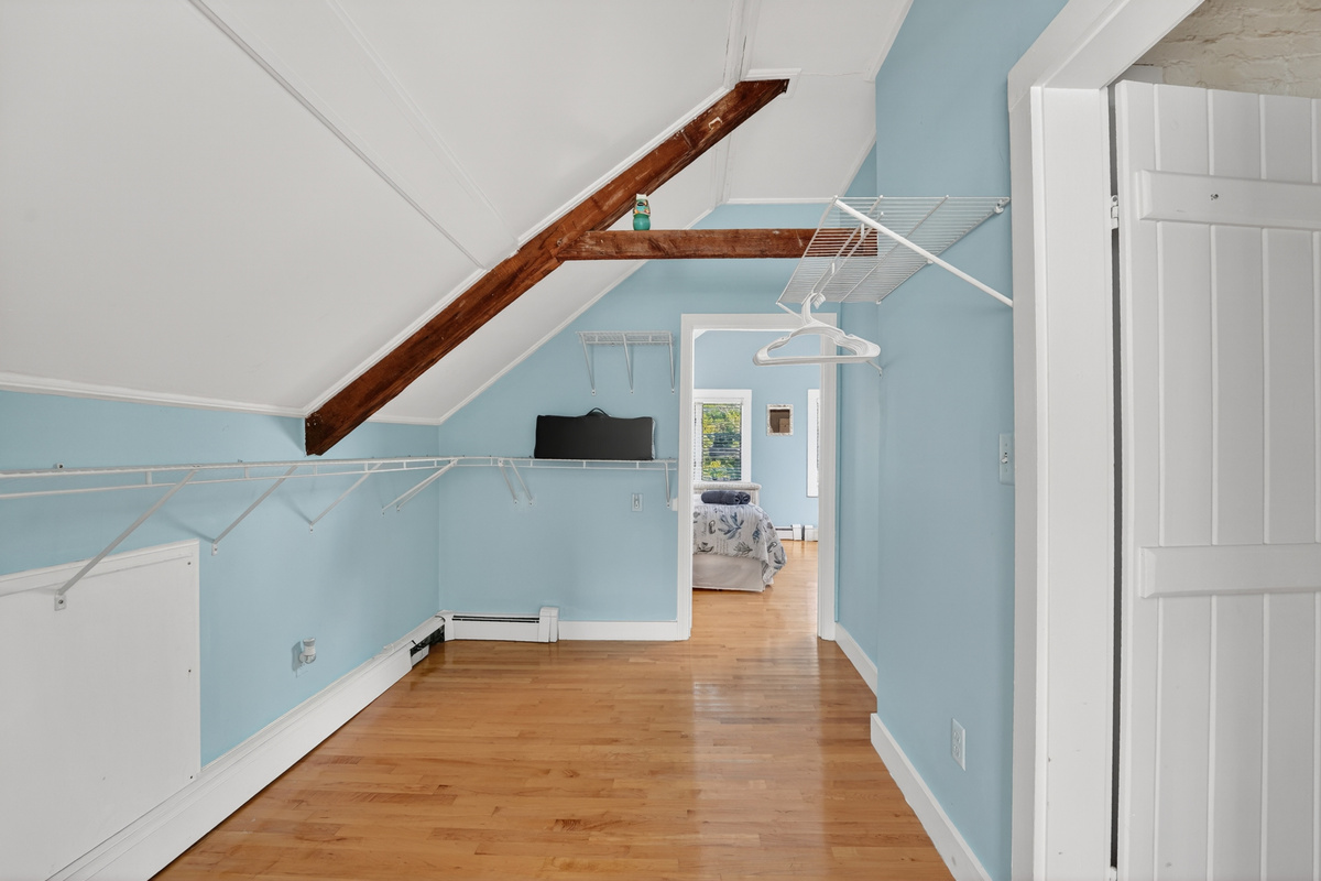 Open loft area offering additional living space, perfect for relaxing, reading, or accommodating your group's needs.