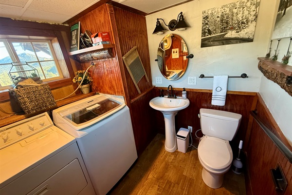 Convenient laundry area with washer/dryer and a half bath — perfect for longer stays and family trips.