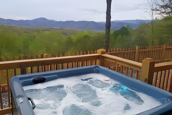 This deck-side hot tub offers a clean, bubbling oasis that serves as the perfect spot to rest your muscles and recharge.