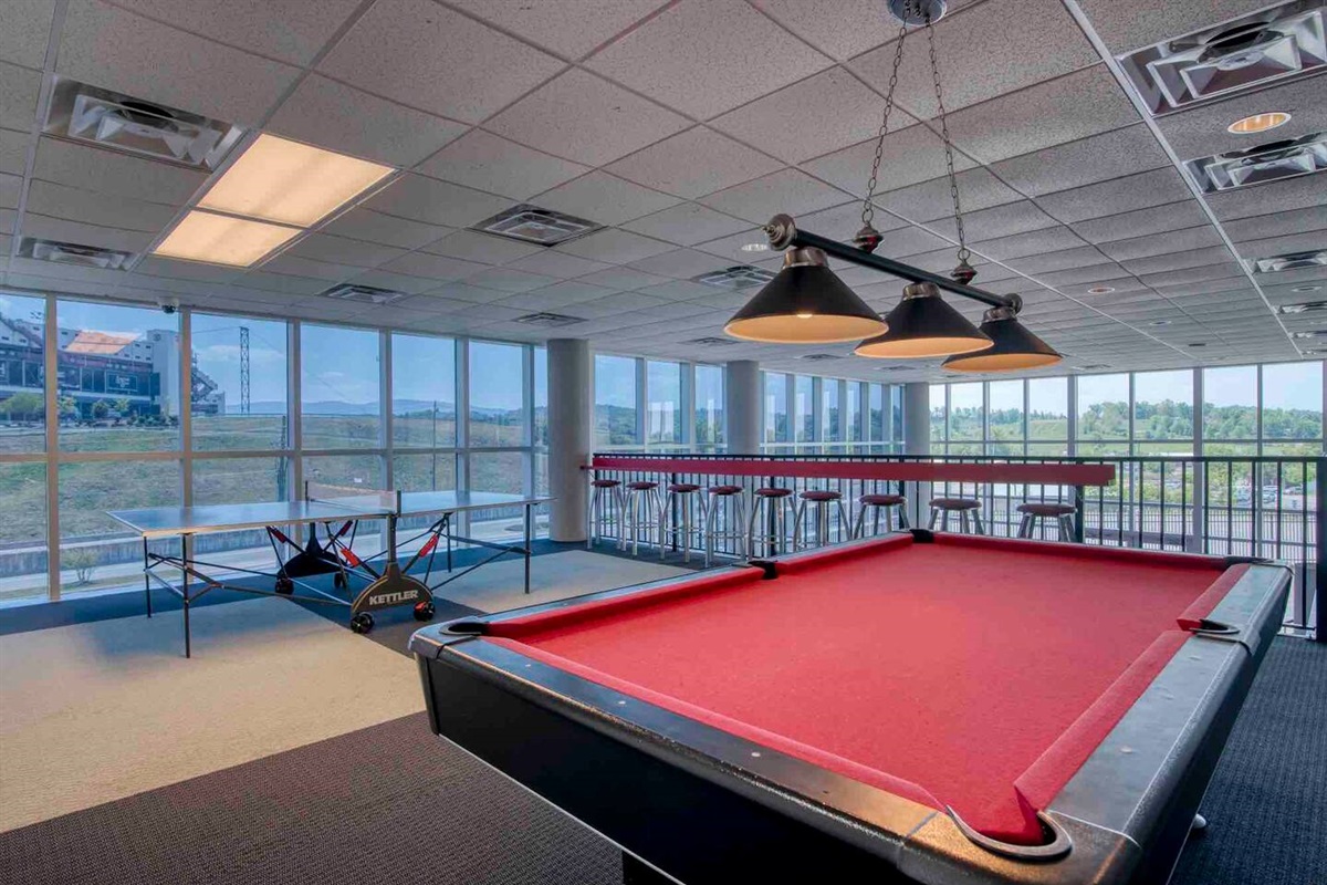 We have a game room equipped with a pool table, ping pong table, and dart board for your entertainment.