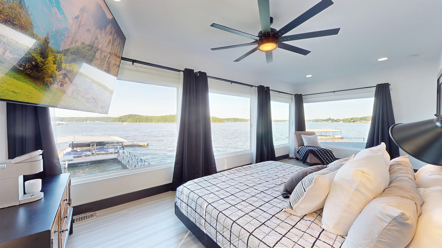 Wake up to this grand view of the lake with windows from floor to ceiling.