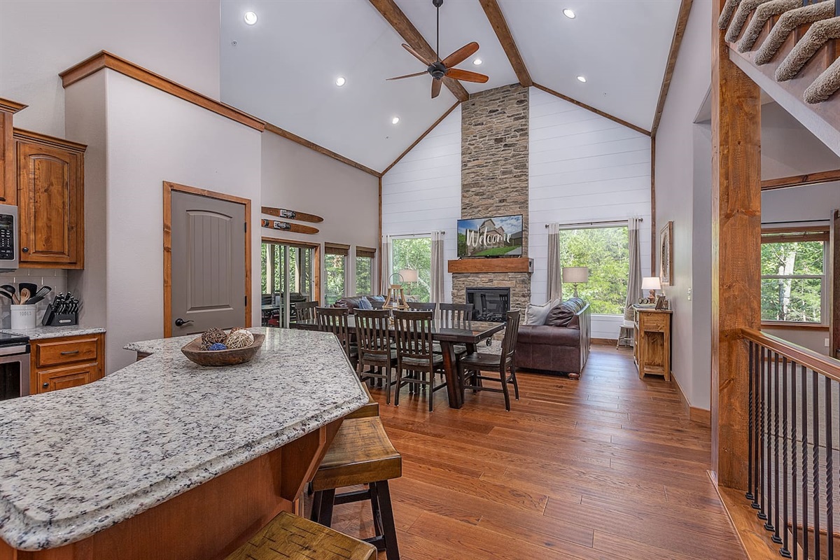 Big gathering area w/kitchen, big dining table, and great room 65" Smart TV