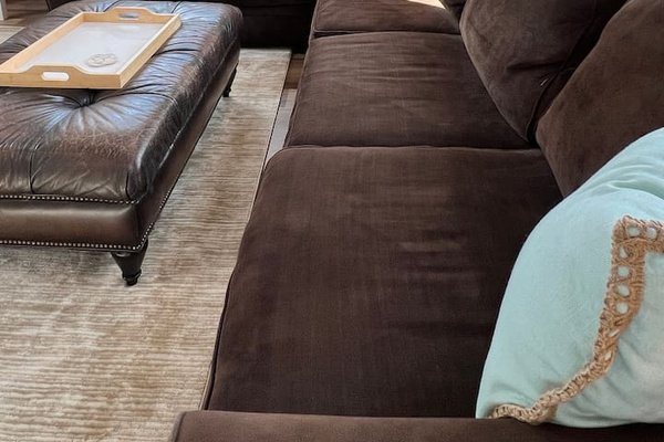 Large comfy living room sectional with pull out full-sized sofa bed 