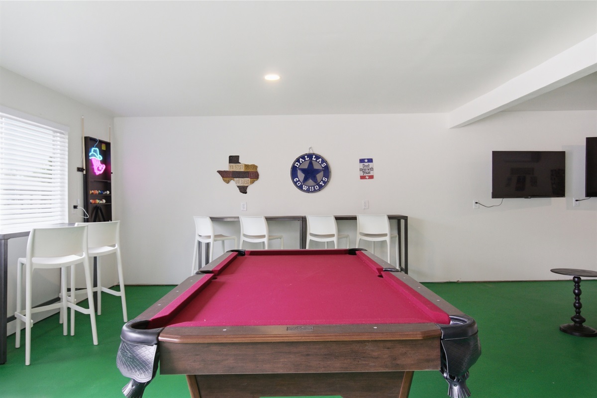 Pool Table and bar area alternate angle. 1,000 sq ft Game Room is the centerpiece of this 4-bedroom Arlington vacation rental.