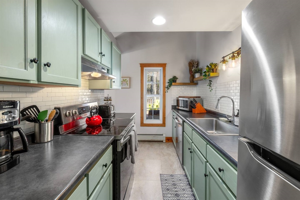 Cozy and sufficiently stocked kitchen