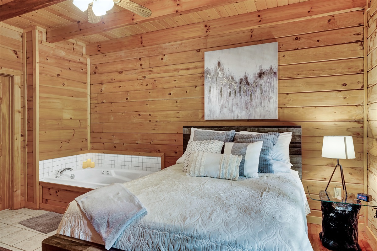 The main floor bedroom is a peaceful retreat with ensuite bathoom, jetted tub and is just off the family room. 