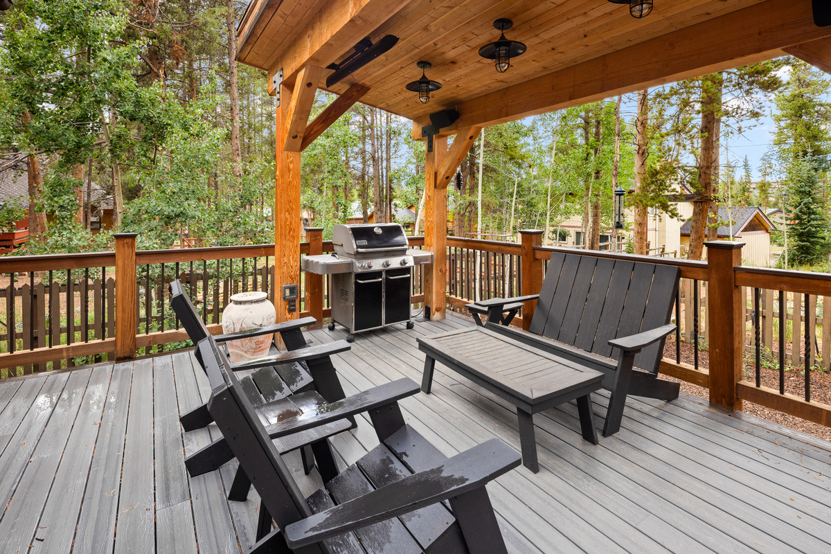 Covered seating and bar-b-que with overhead outdoor heaters. 