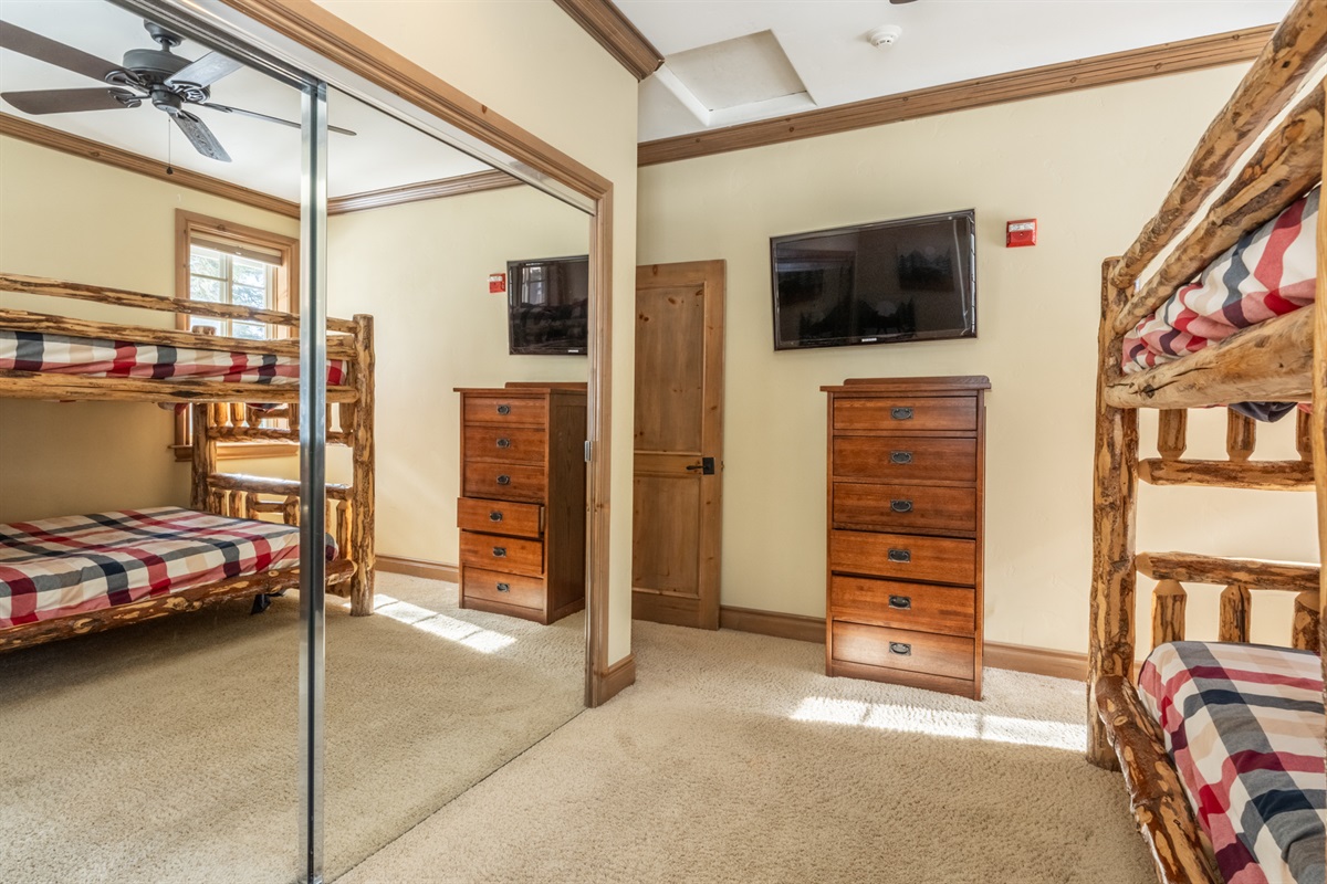 Double over double bunks in a light-filled, South facing room with built in window seat.