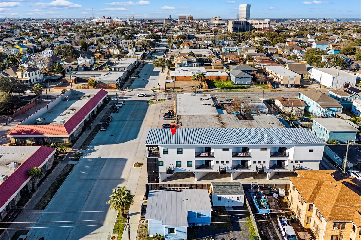 Charming Retreat: Explore vibrant Galveston from your stylish balcony-view escape!