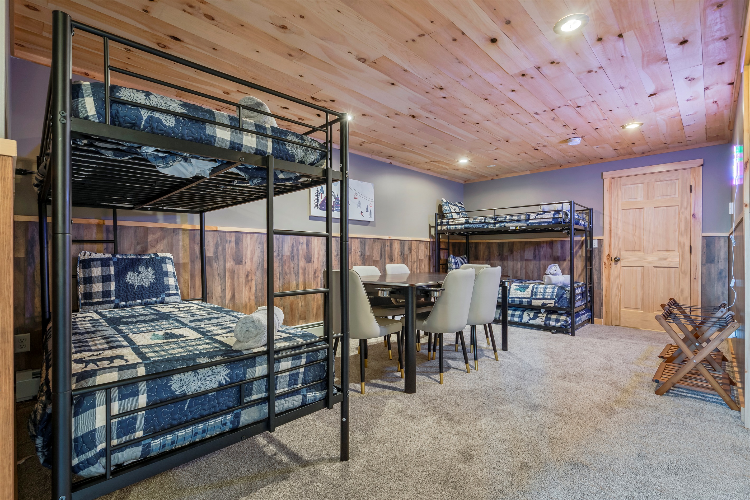 Downstairs bunk beds offer a comfortable and playful space for extra guests and little adventurers.
