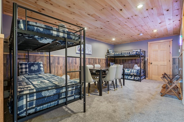 Downstairs bunk beds offer a comfortable and playful space for extra guests and little adventurers.