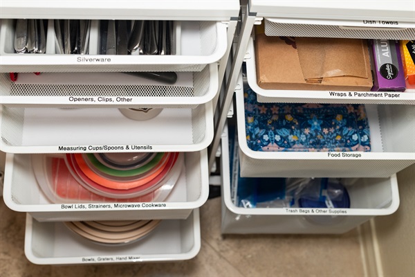 Organized drawers with utensils and kitchen tools